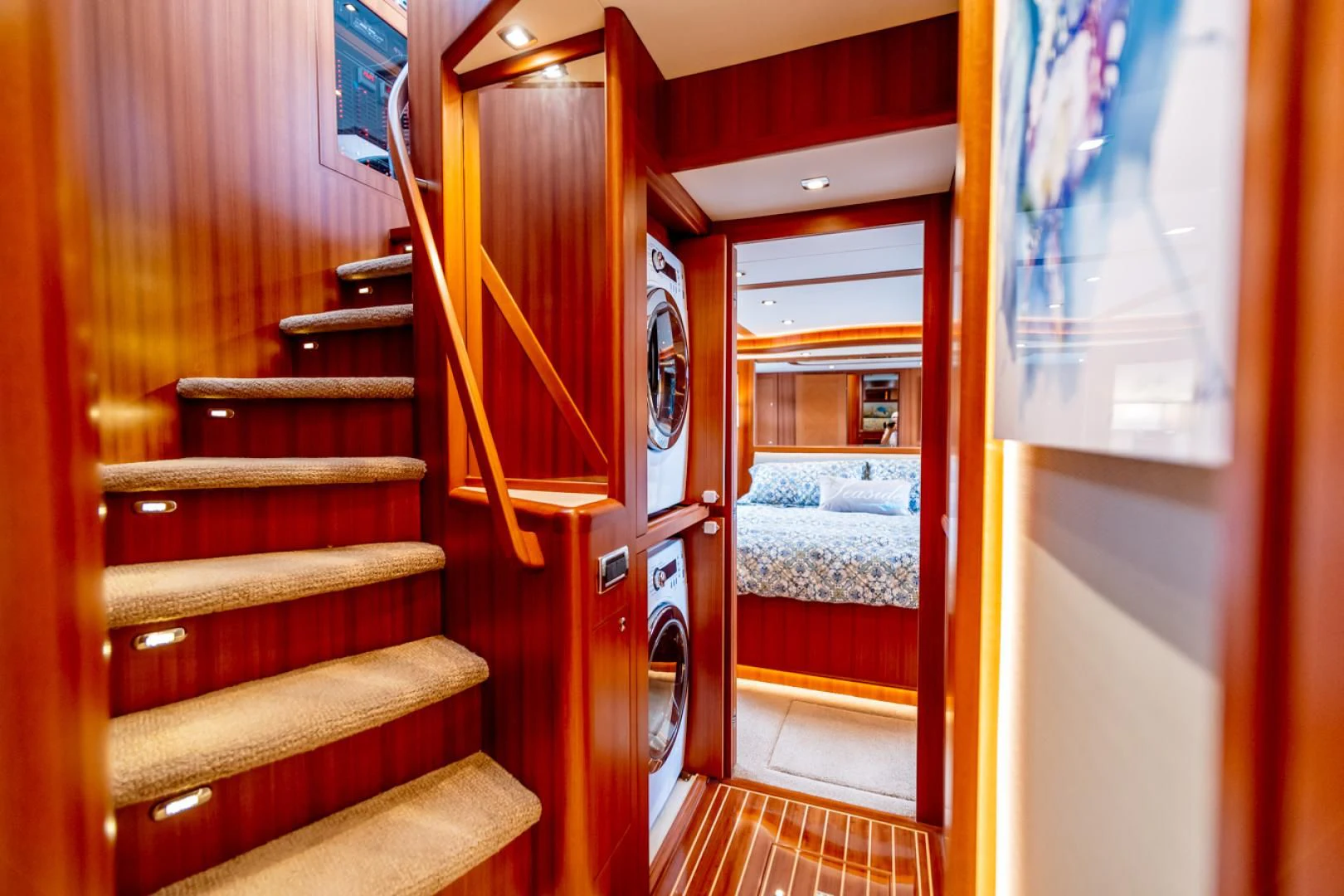 a room with a bunk bed and a red door aboard MAHALO Yacht for Sale
