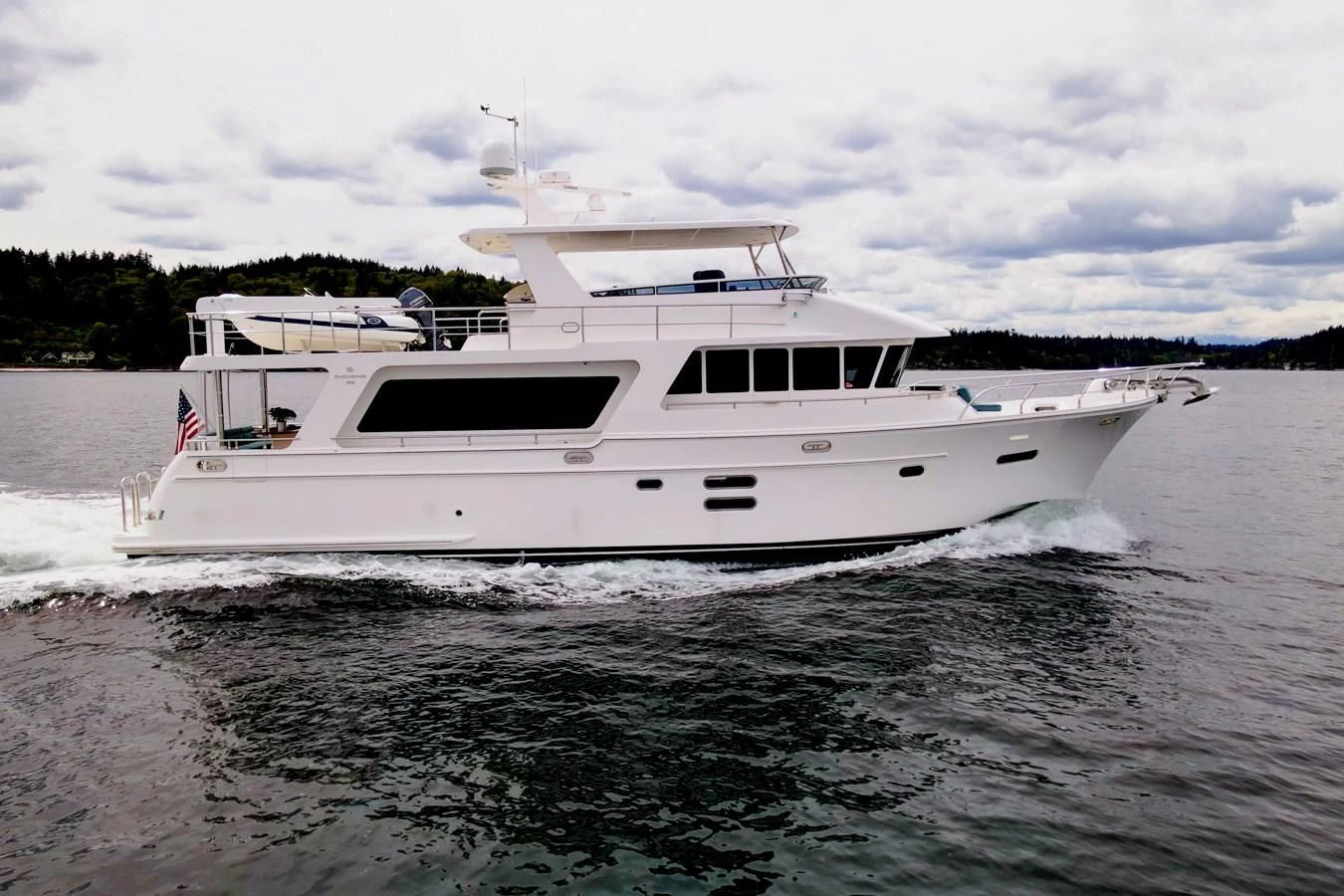 a white boat on the water aboard MAHALO Yacht for Sale