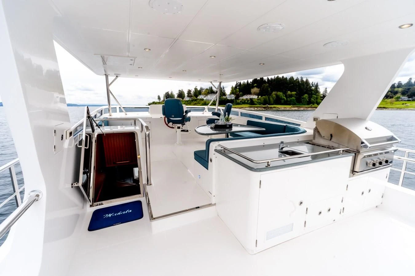 a room with a pool table and chairs aboard MAHALO Yacht for Sale