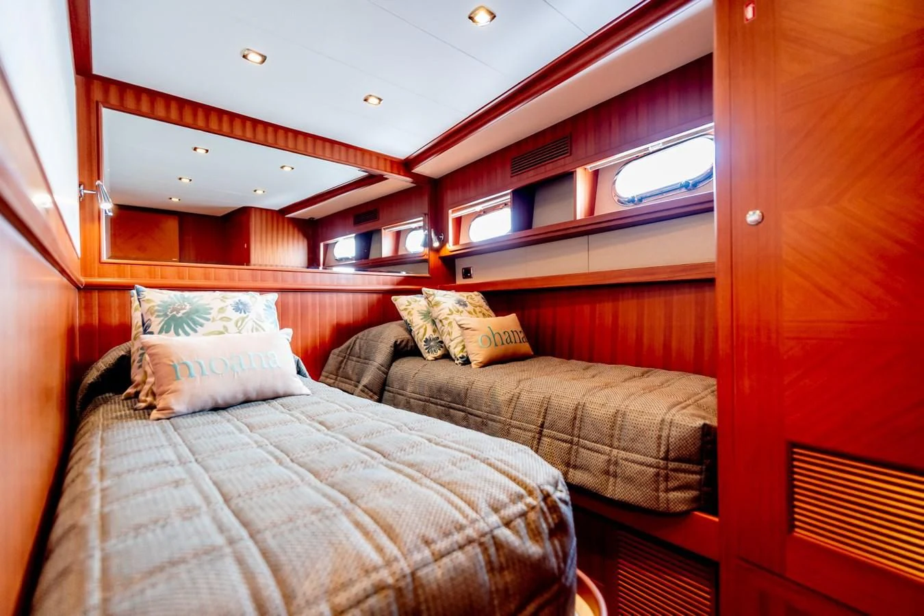 a room with a bed and a window aboard MAHALO Yacht for Sale