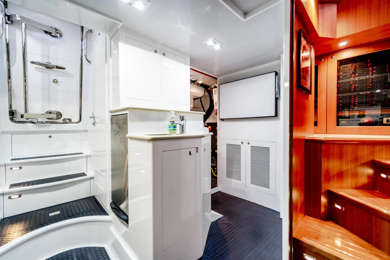 a room with a closet and a bed aboard MAHALO Yacht for Sale