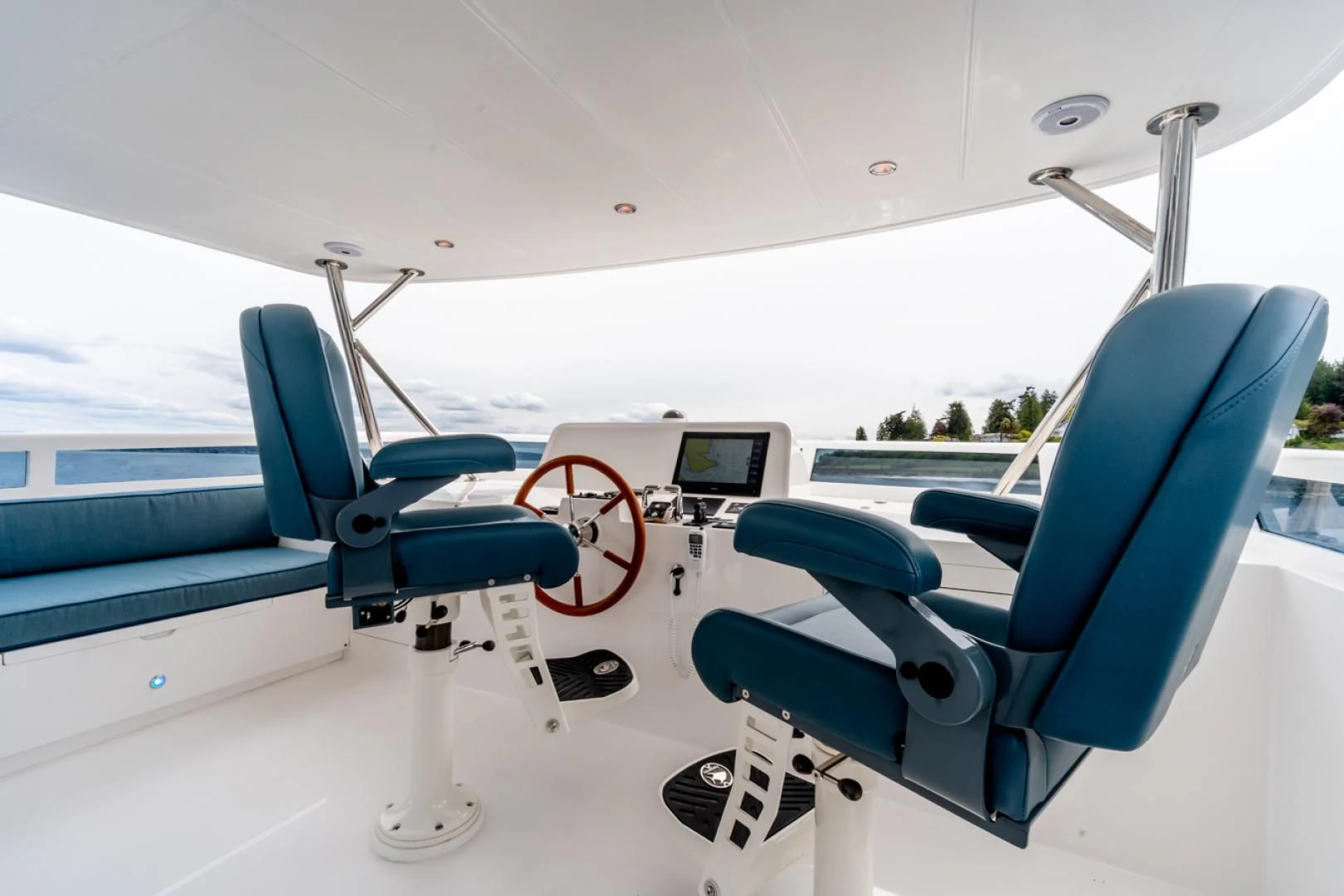 a blue chair on a boat aboard MAHALO Yacht for Sale