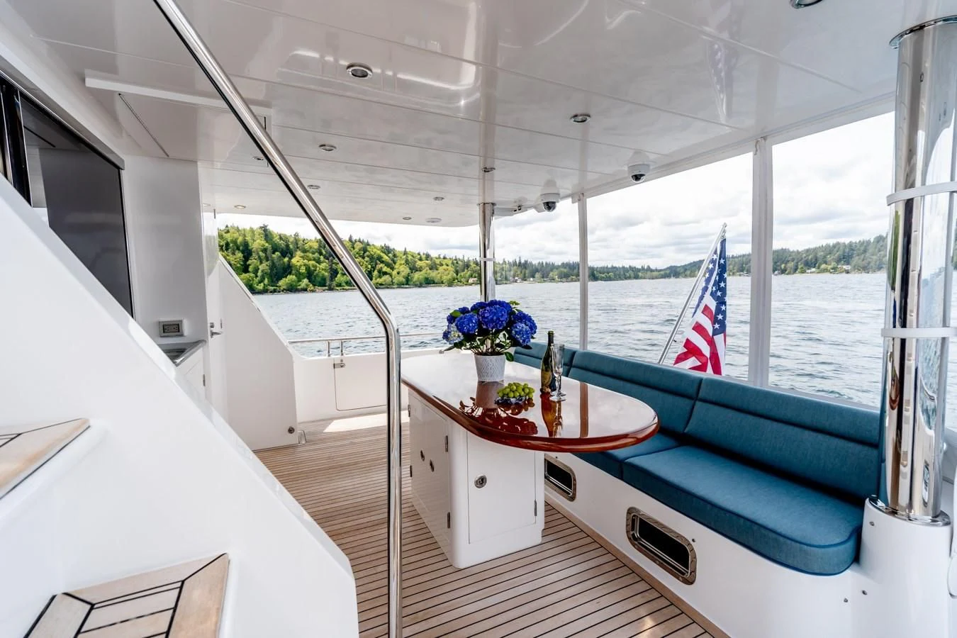 a boat with a flag on the deck aboard MAHALO Yacht for Sale