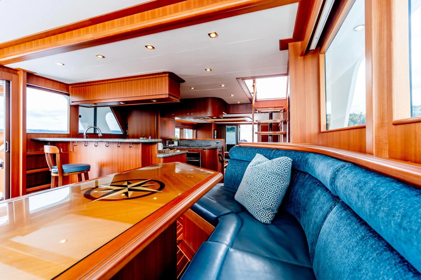 a living room with a couch and a table aboard MAHALO Yacht for Sale