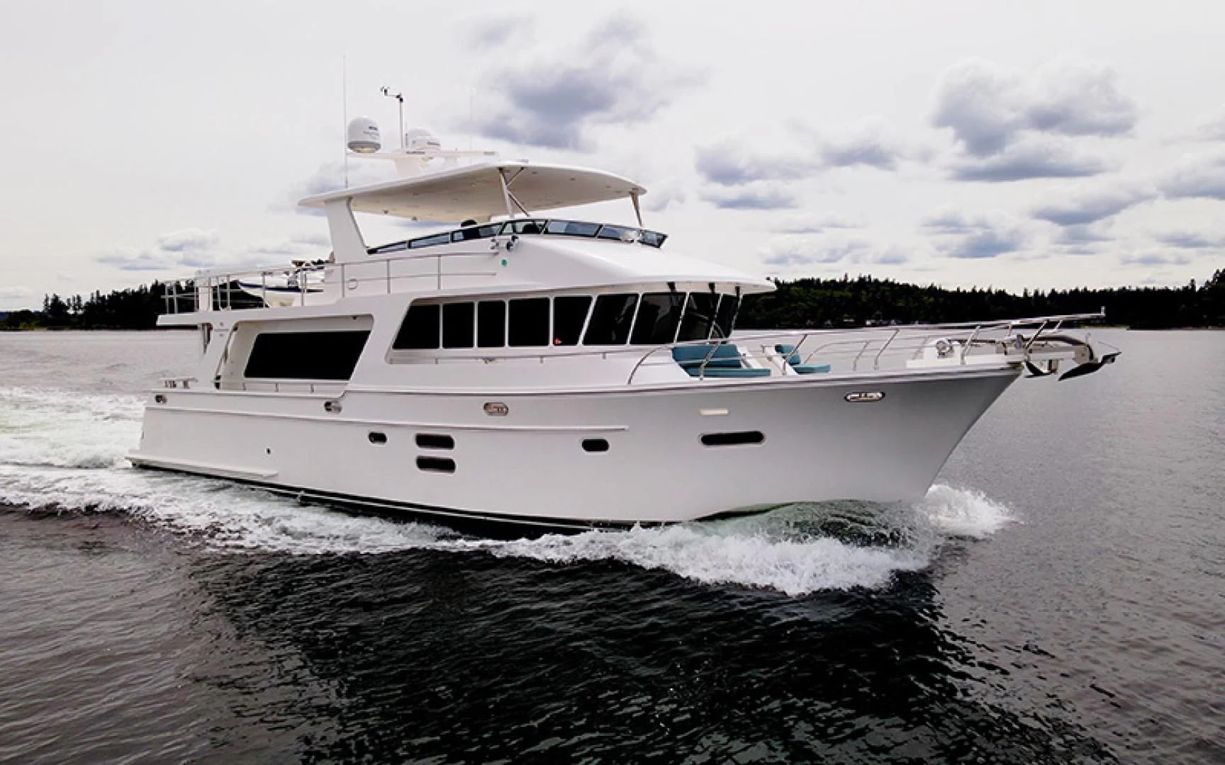 a white boat on the water aboard MAHALO Yacht for Sale