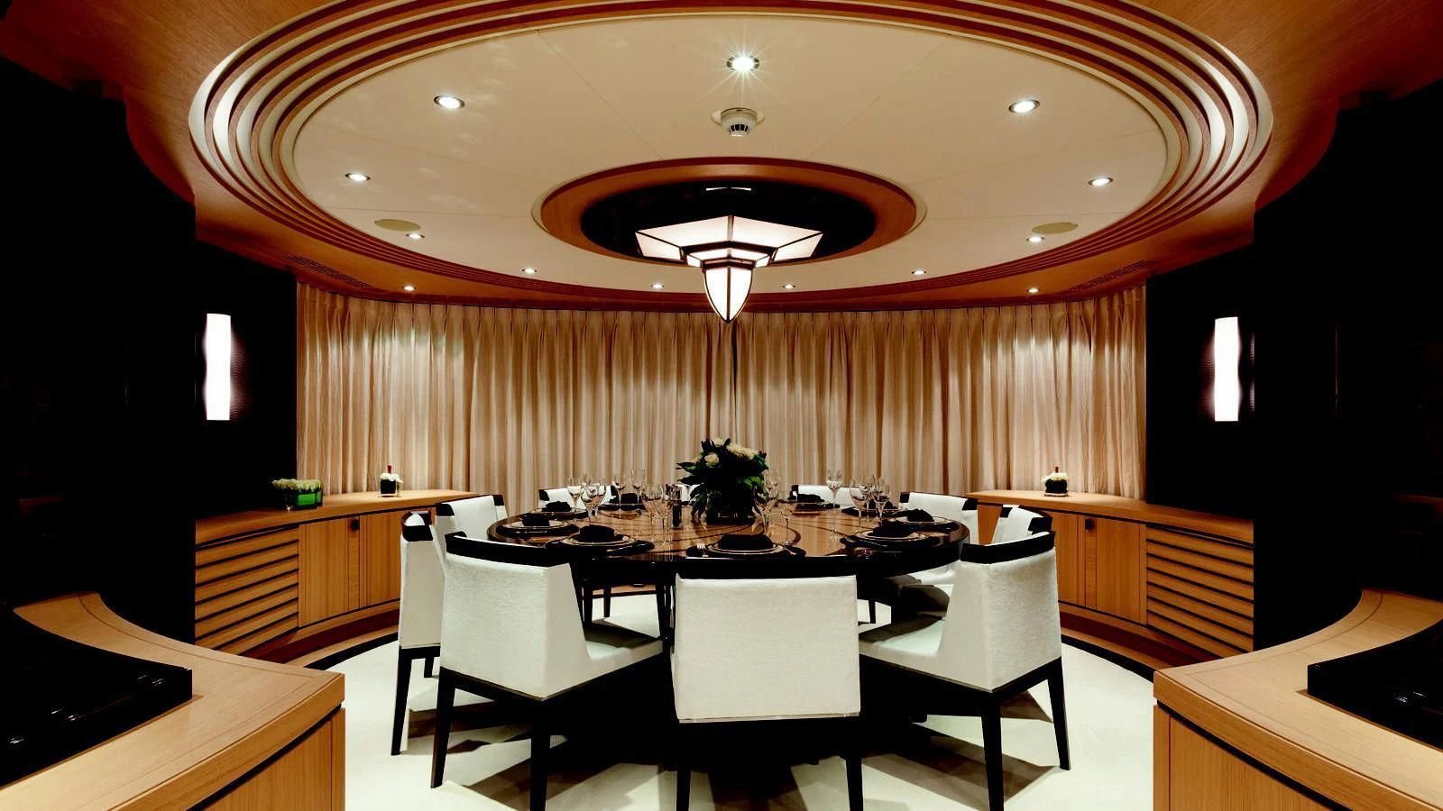 a room with a table and chairs aboard TAURICA Yacht for Sale