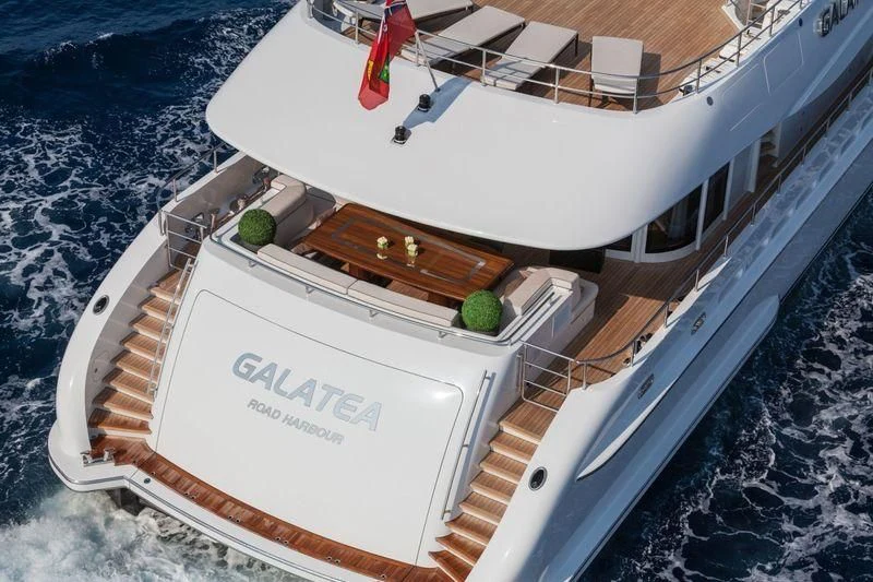 a white boat with a wooden dock aboard TAURICA Yacht for Sale