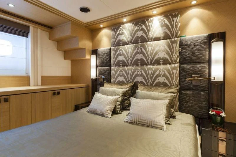 a bed with pillows aboard TAURICA Yacht for Sale