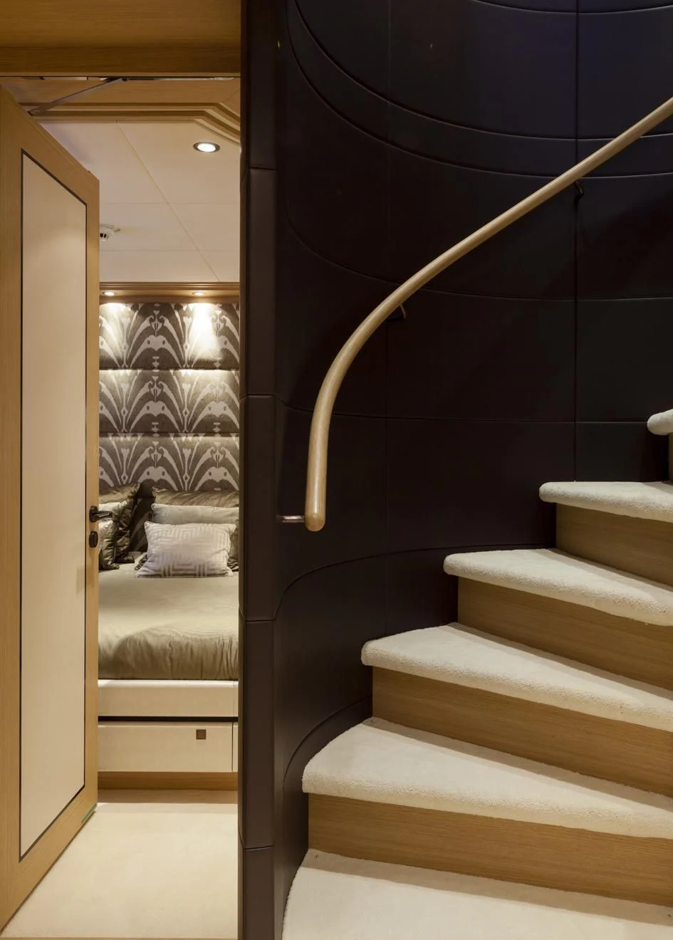 a cat lying on a staircase aboard TAURICA Yacht for Sale