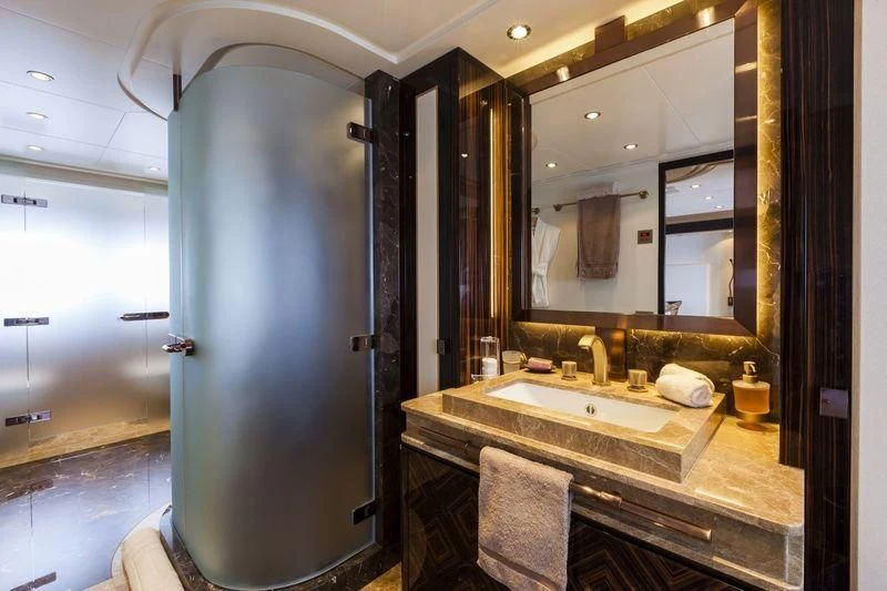 a bathroom with a large mirror aboard TAURICA Yacht for Sale