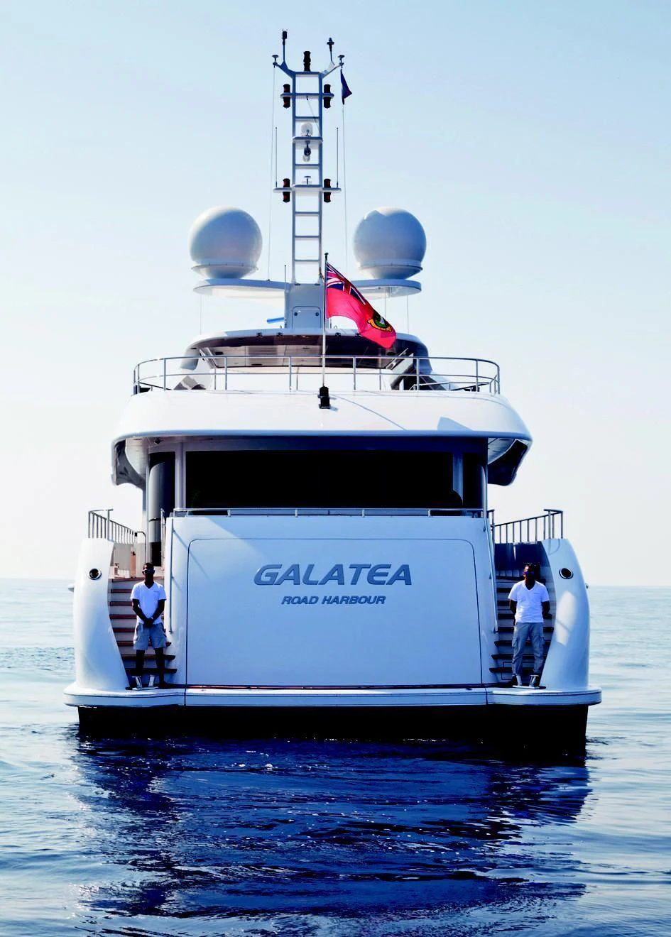 a boat with a flag on the front aboard TAURICA Yacht for Sale