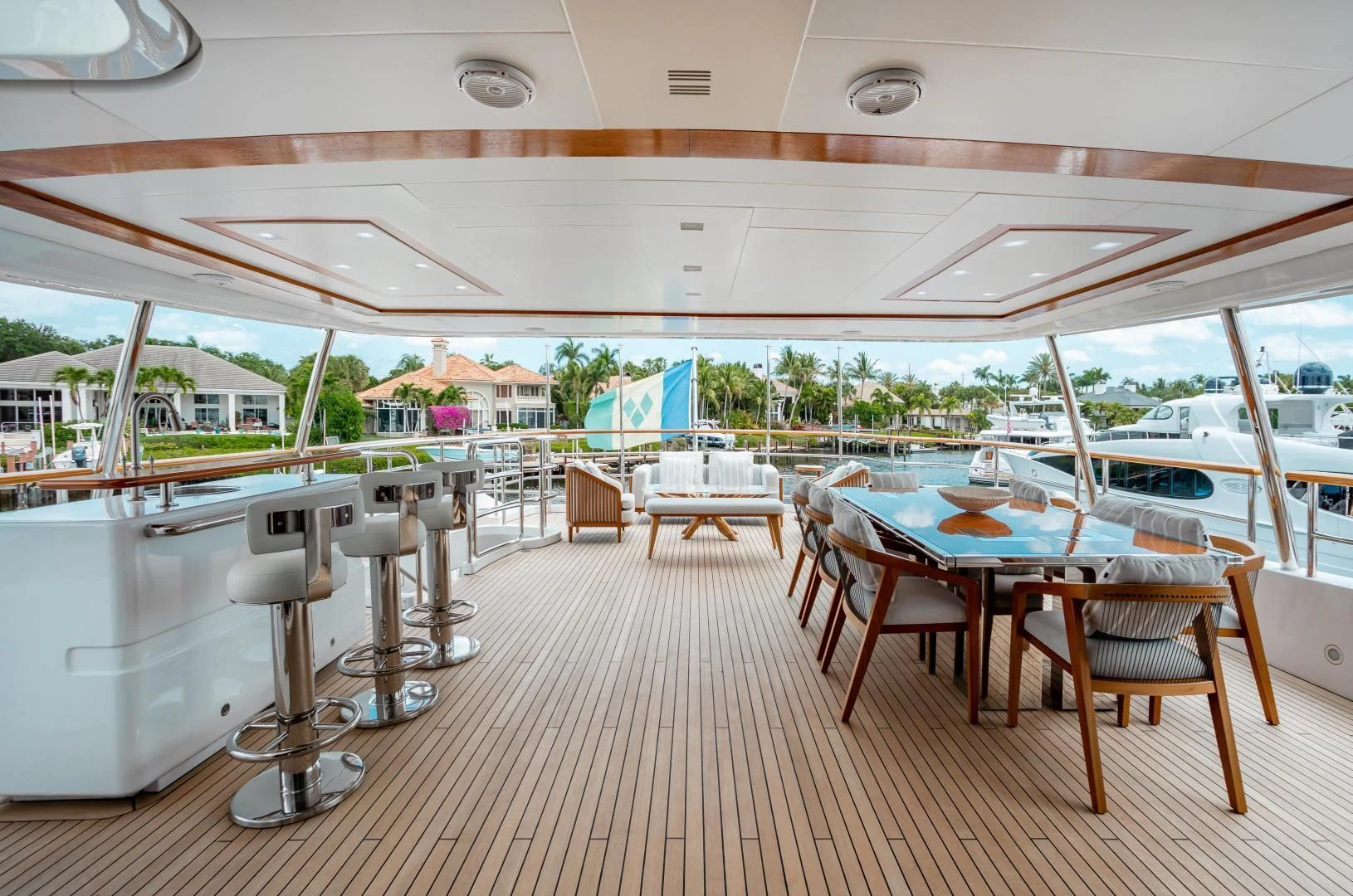 a room with tables and chairs aboard ALLORA Yacht for Sale