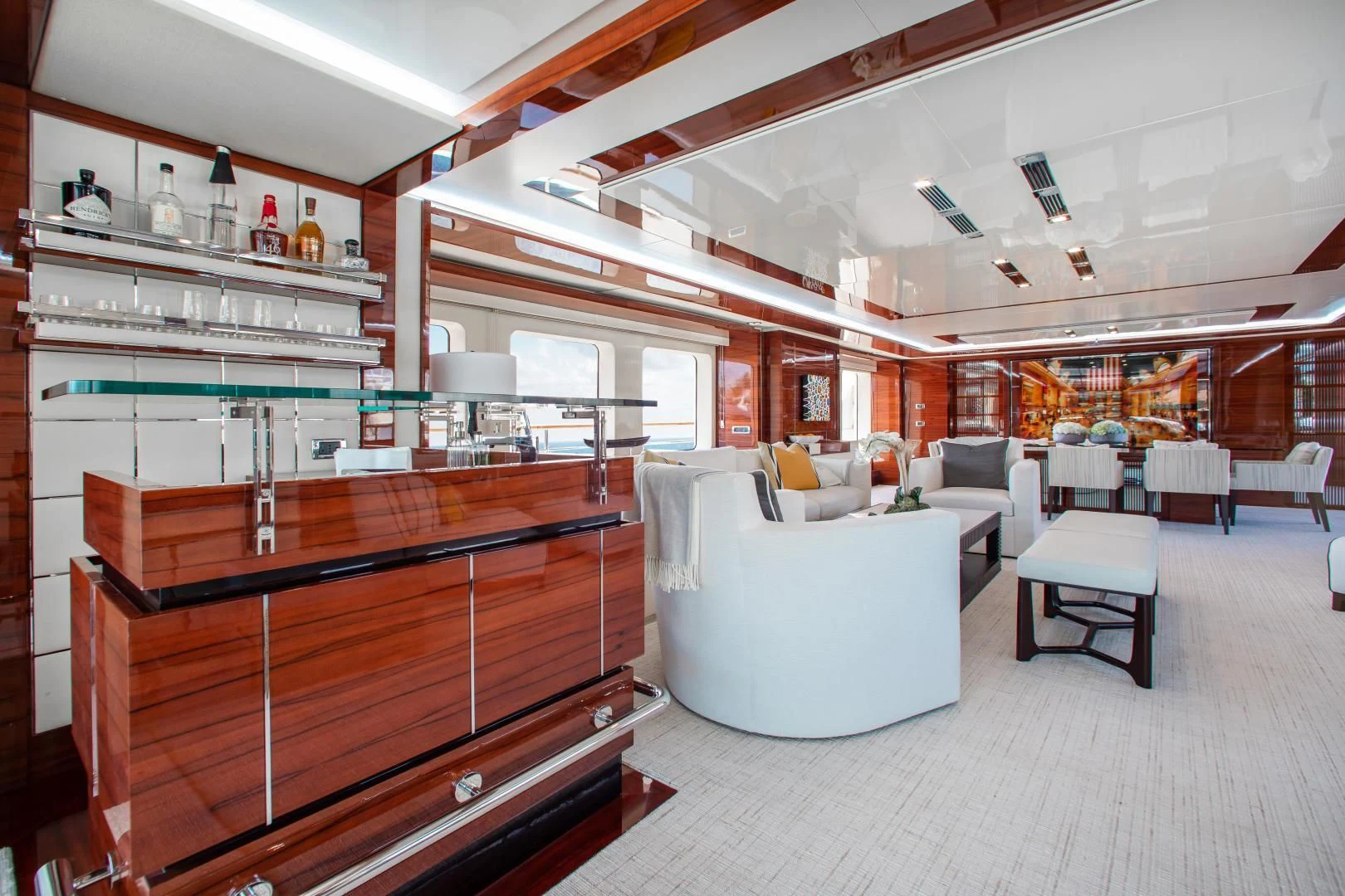 a room with a large white couch and a large shelving unit aboard ALLORA Yacht for Sale