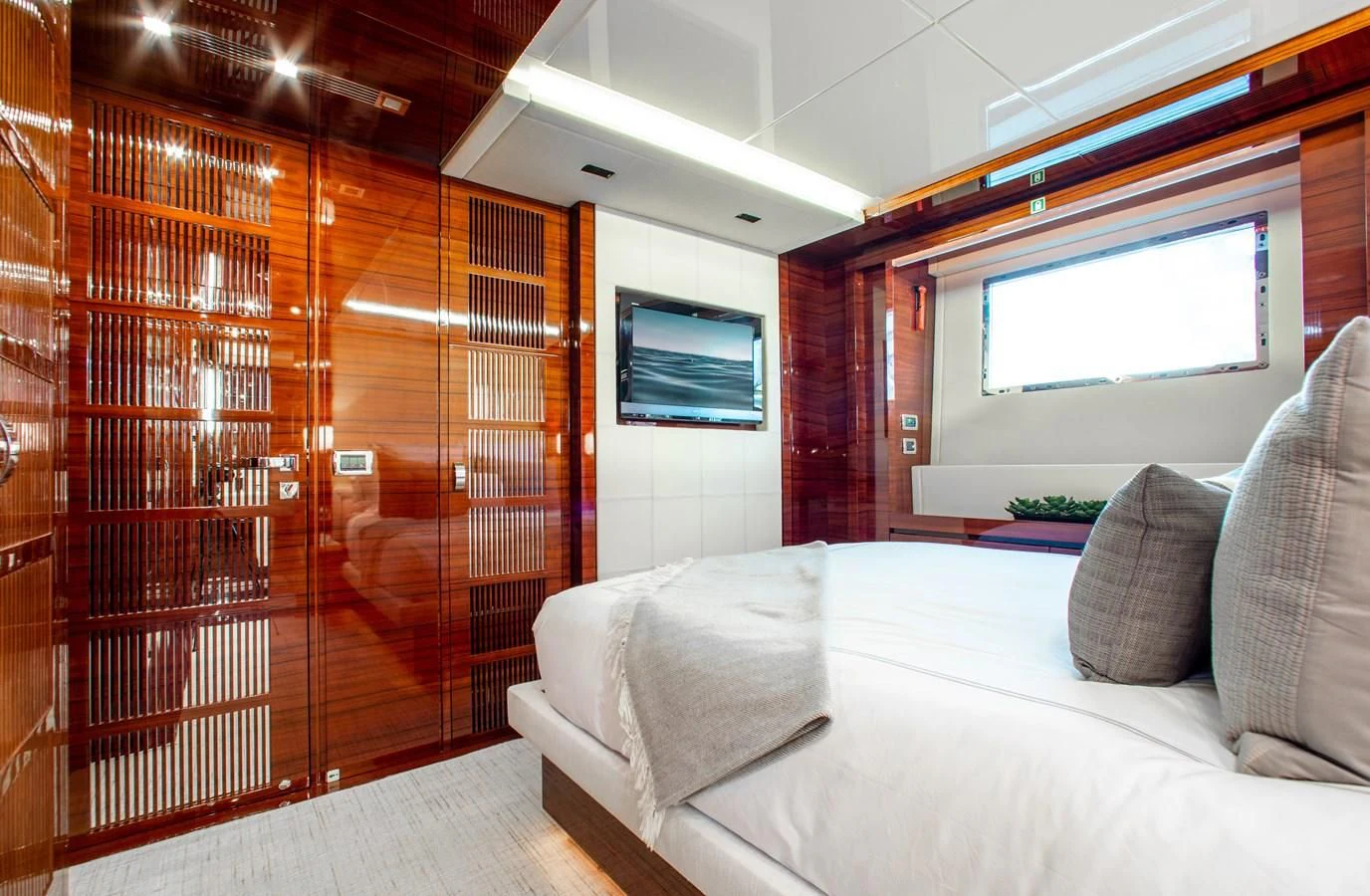 a room with a bed and a couch aboard ALLORA Yacht for Sale