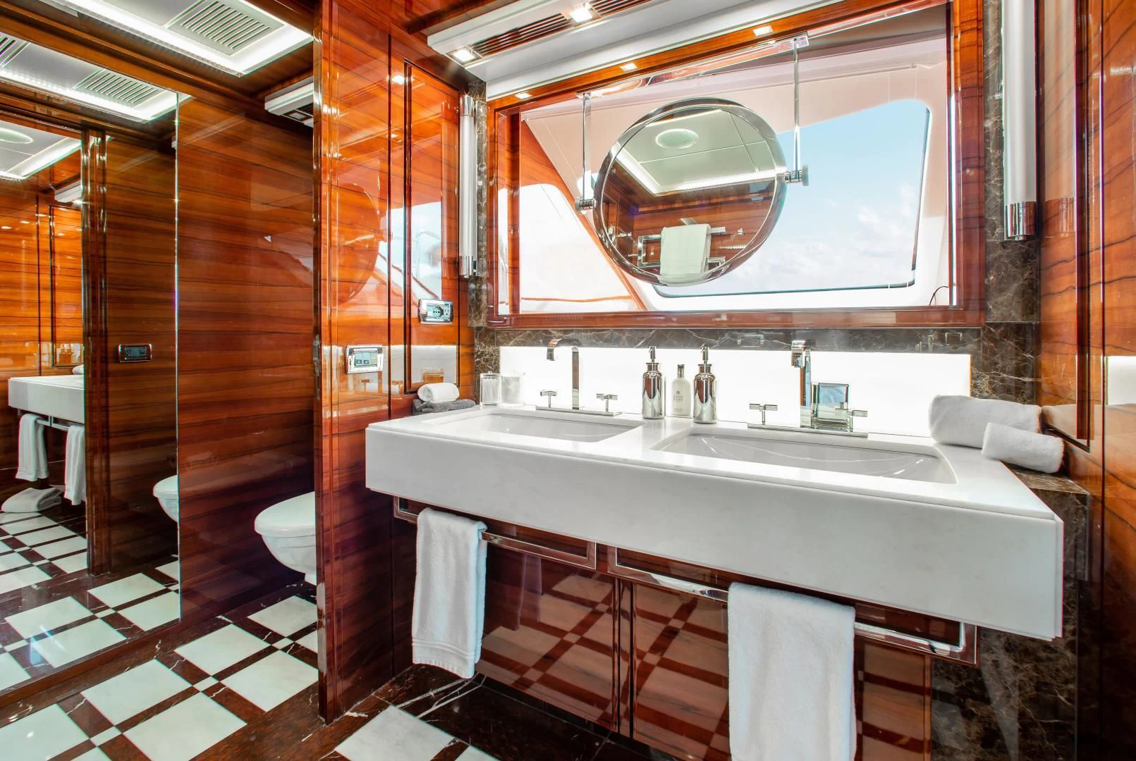 a bathroom with a large mirror aboard ALLORA Yacht for Sale