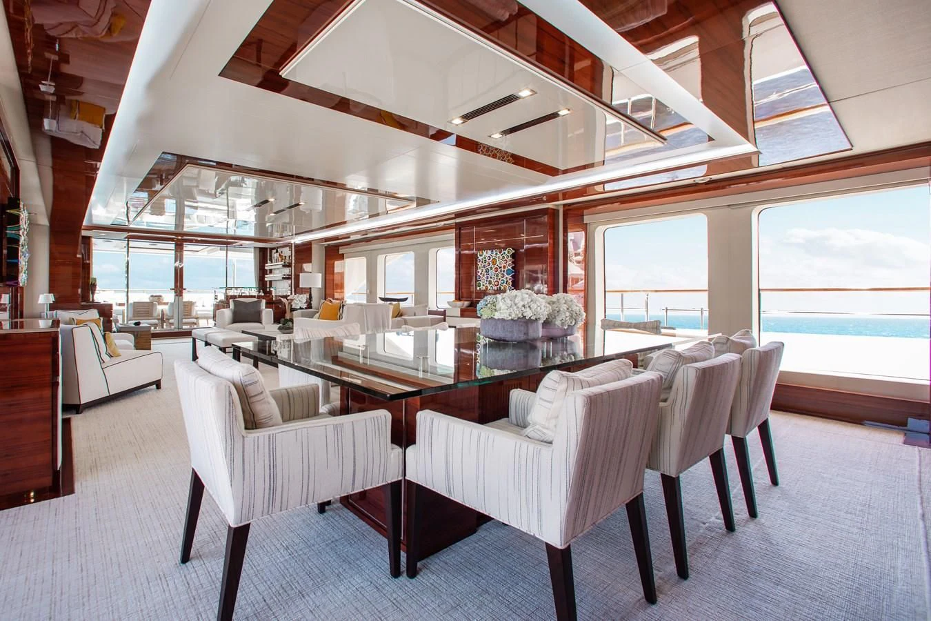 a room with a table and chairs aboard ALLORA Yacht for Sale