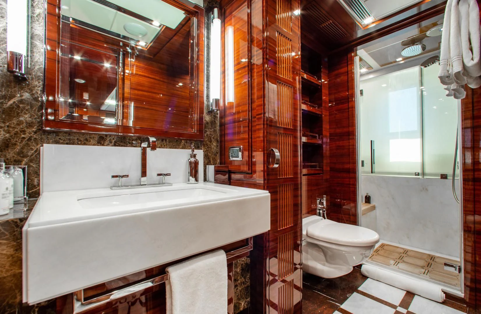 a bathroom with a tub toilet and sink aboard ALLORA Yacht for Sale