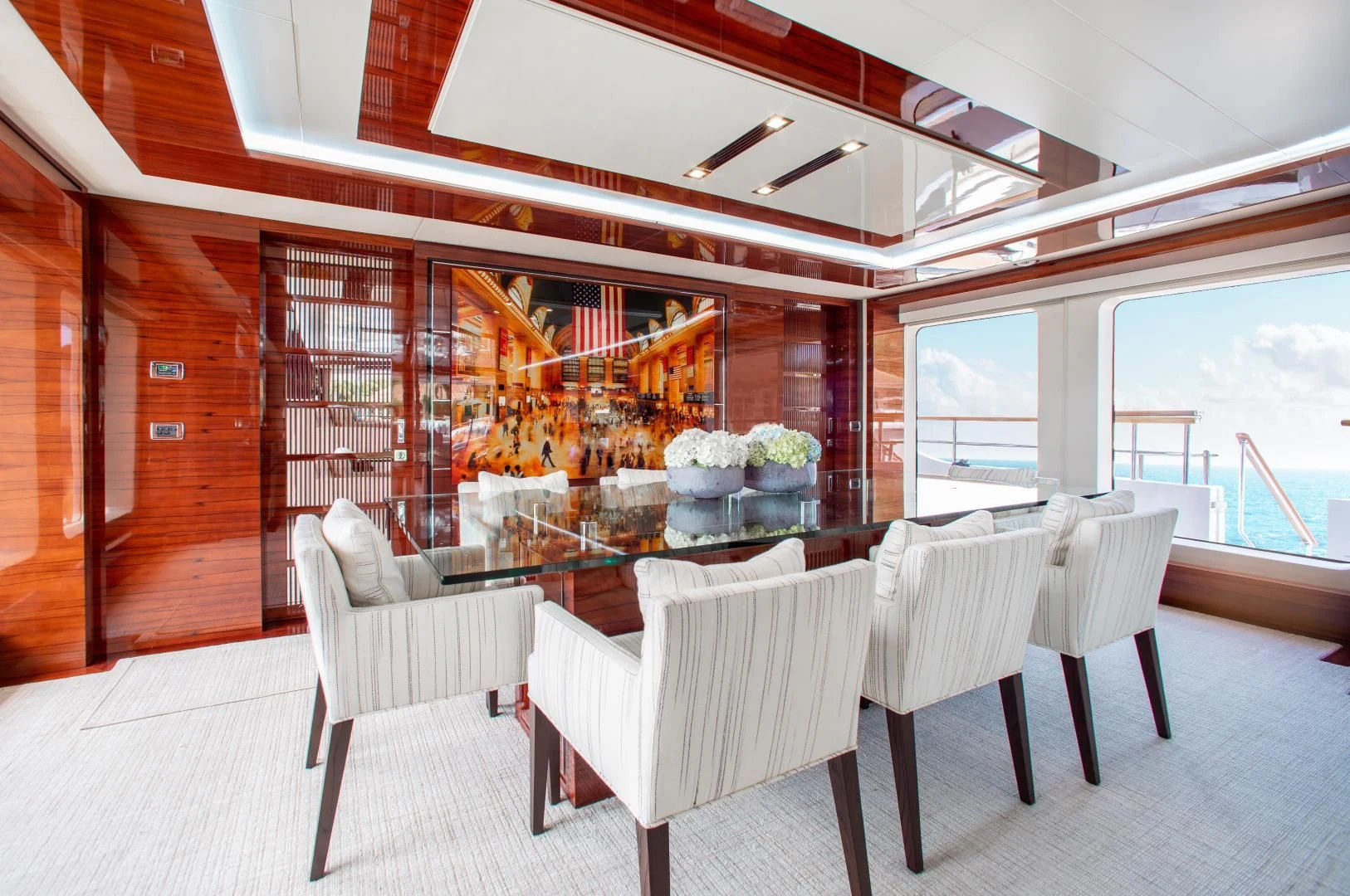 a room with chairs and a fireplace aboard ALLORA Yacht for Sale