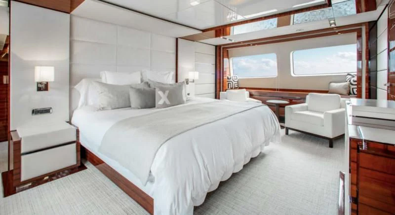 a large bedroom with a large bed aboard ALLORA Yacht for Sale