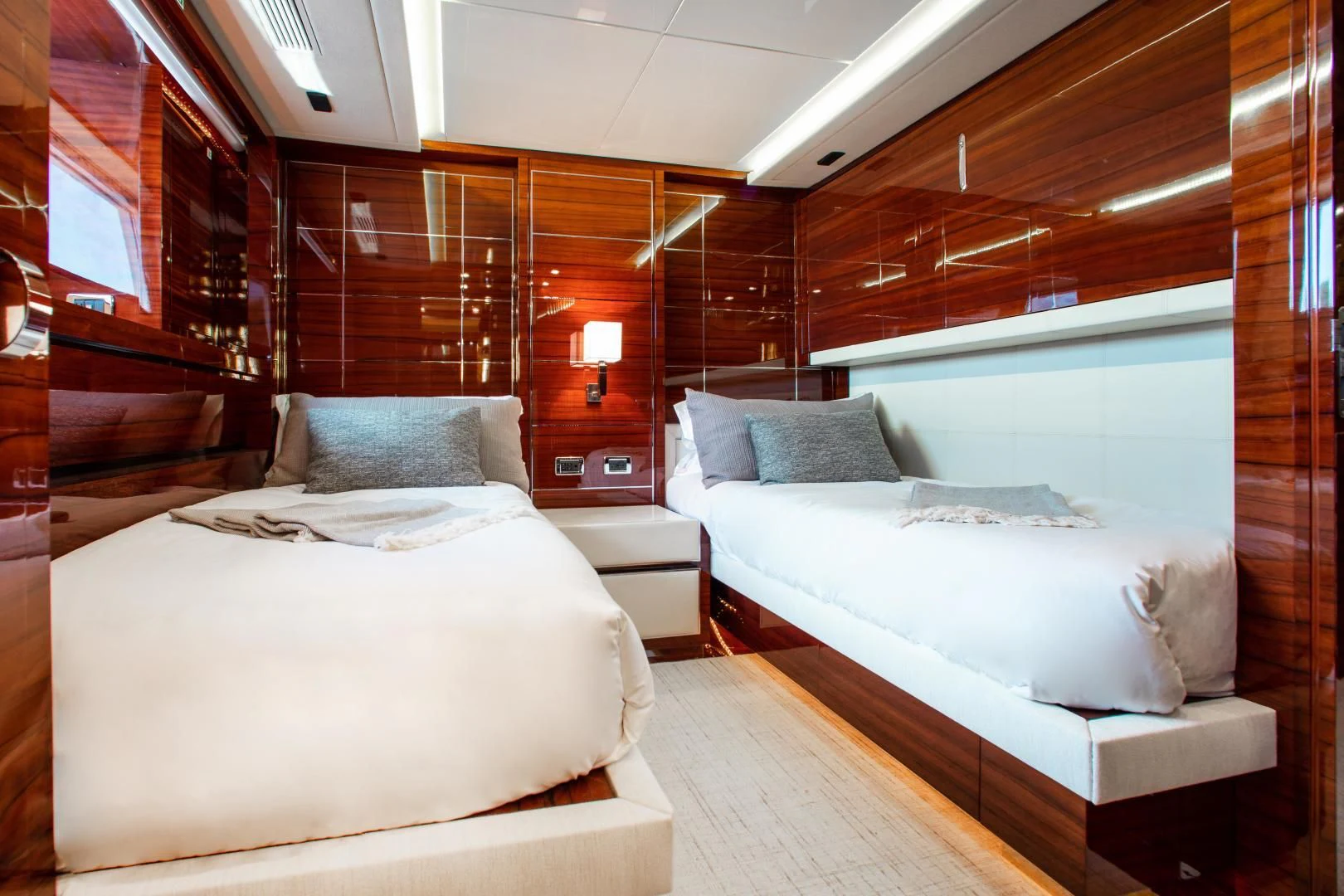 a room with two beds aboard ALLORA Yacht for Sale