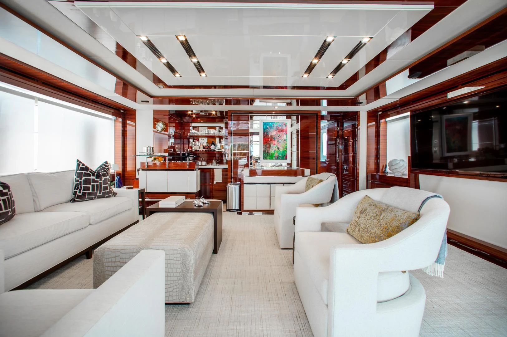 a living room with white furniture aboard ALLORA Yacht for Sale