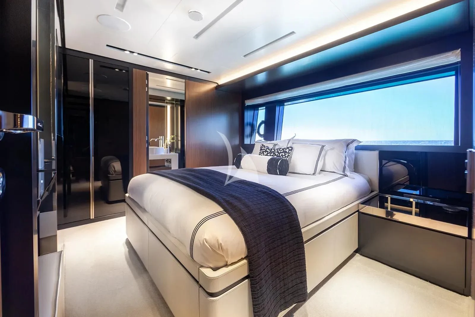 a room with a bed and a desk aboard LEMON NOT LIME Yacht for Sale