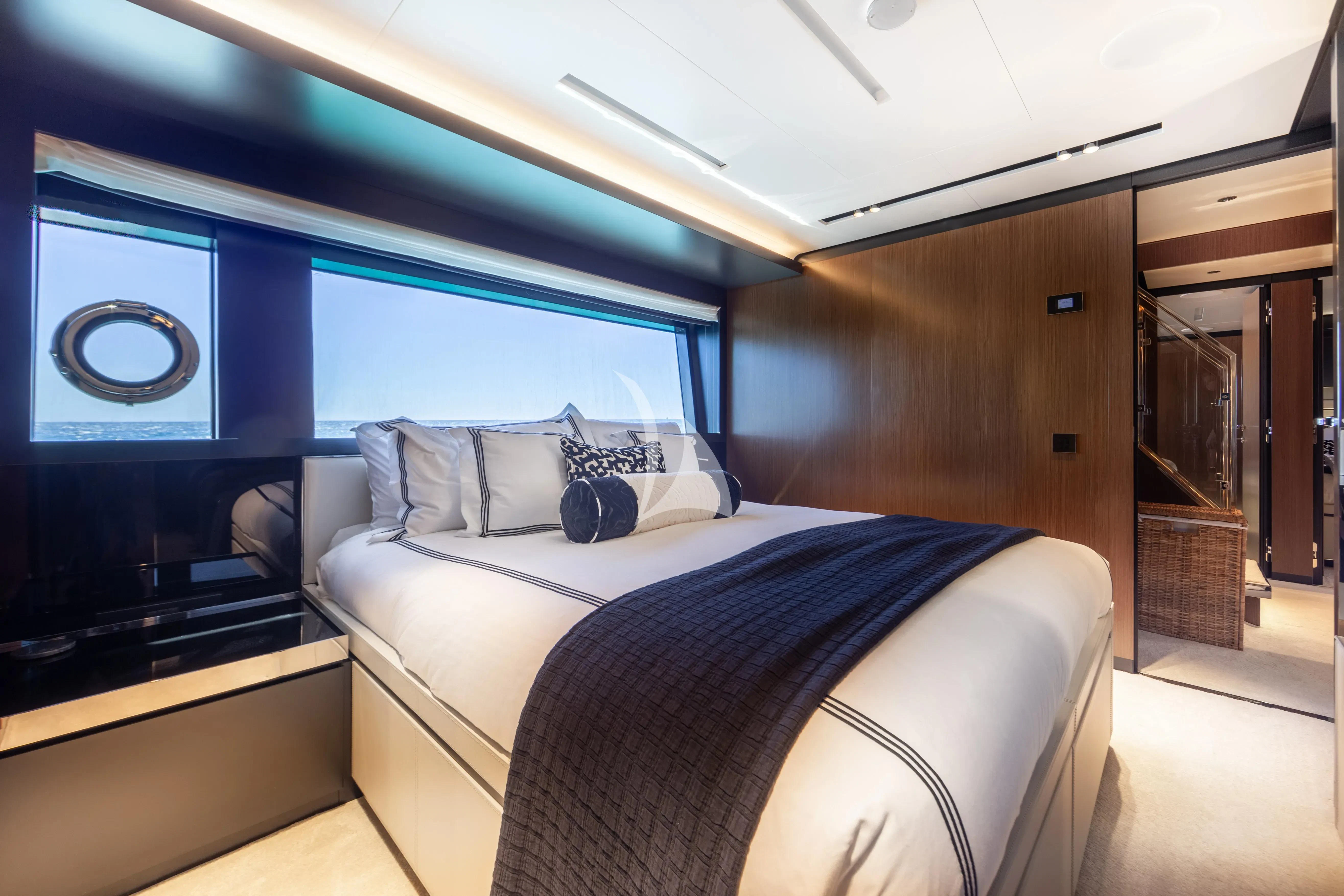 a room with a bed and a television aboard LEMON NOT LIME Yacht for Sale