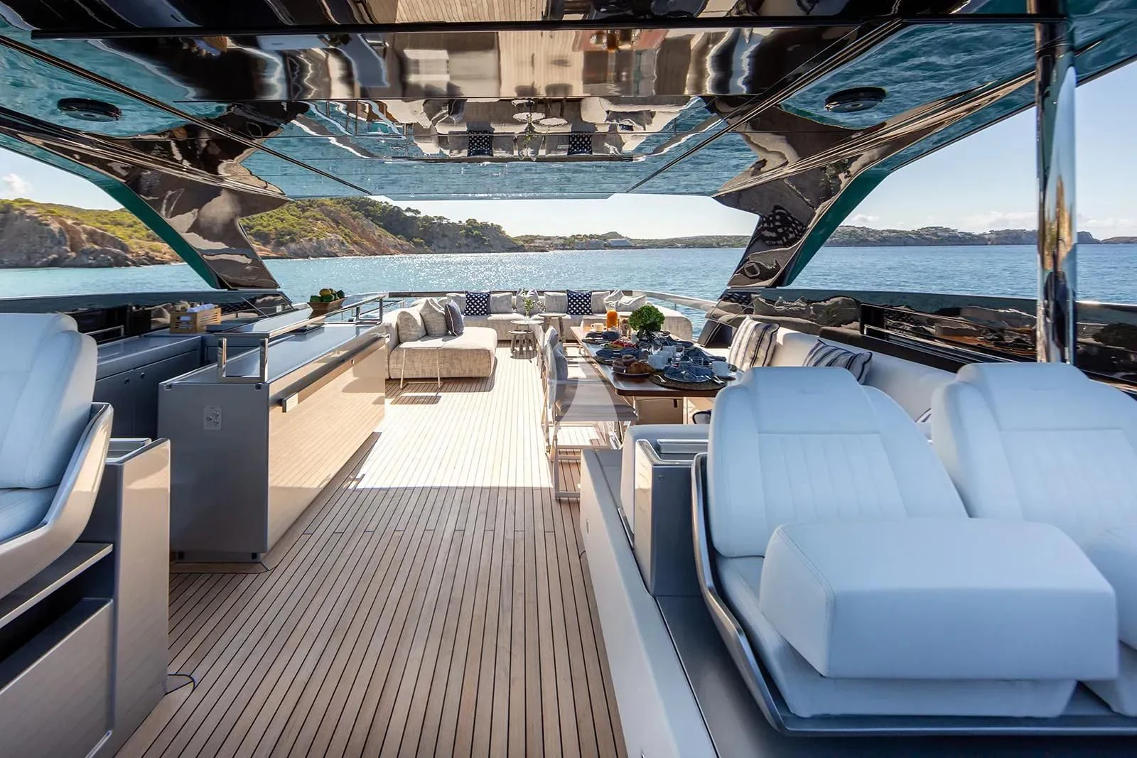 a deck with a view of a city and water aboard LEMON NOT LIME Yacht for Sale