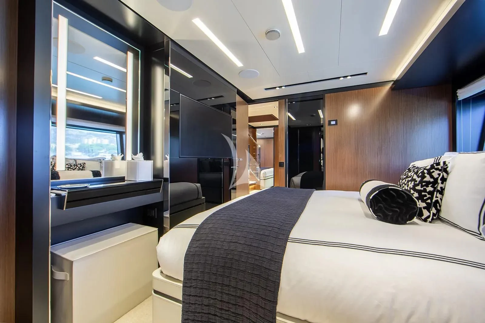 a room with a bed and desk aboard LEMON NOT LIME Yacht for Sale