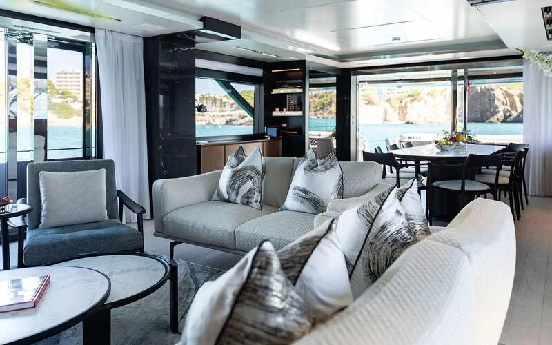a living room with a large window aboard LEMON NOT LIME Yacht for Sale