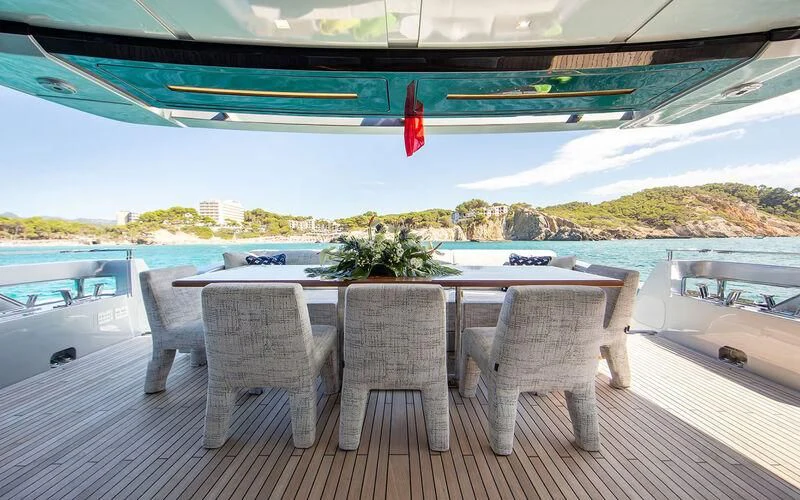 a table and chairs on a deck aboard LEMON NOT LIME Yacht for Sale