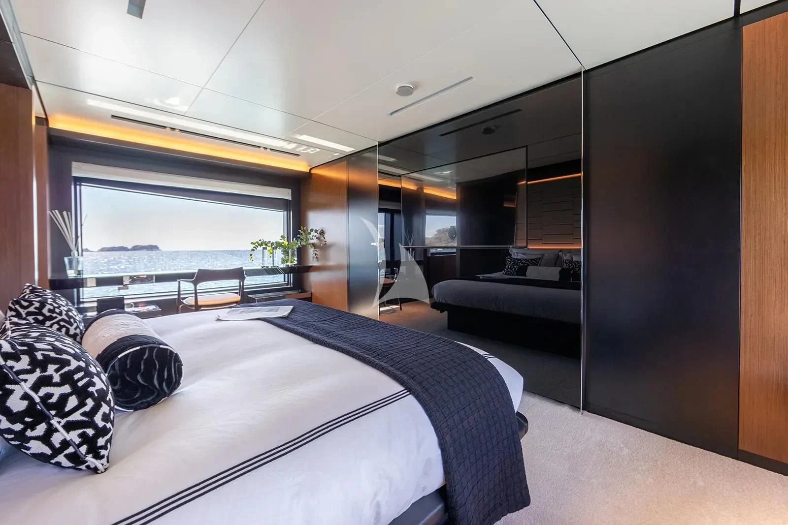 a large bedroom with a large bed aboard LEMON NOT LIME Yacht for Sale