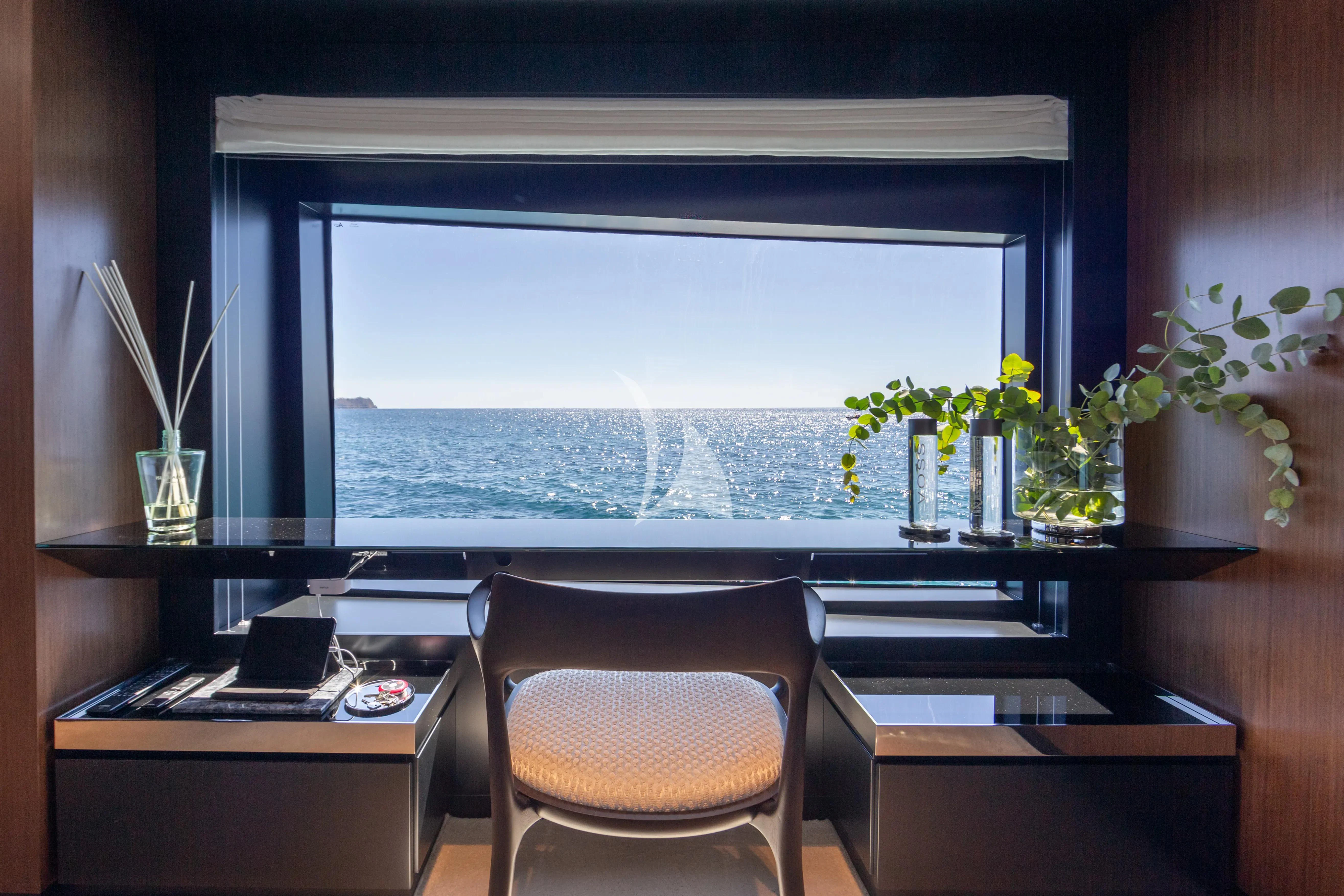 a room with a window and plants aboard LEMON NOT LIME Yacht for Sale