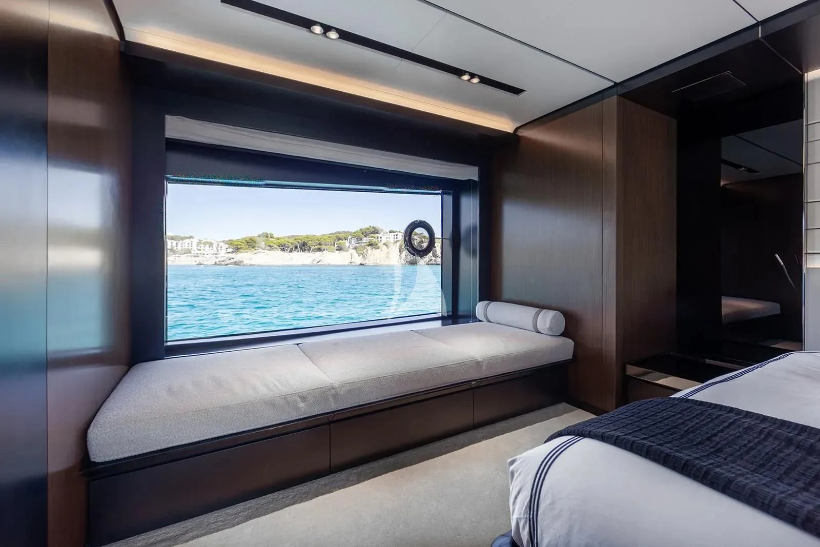 a room with a bed and a window aboard LEMON NOT LIME Yacht for Sale