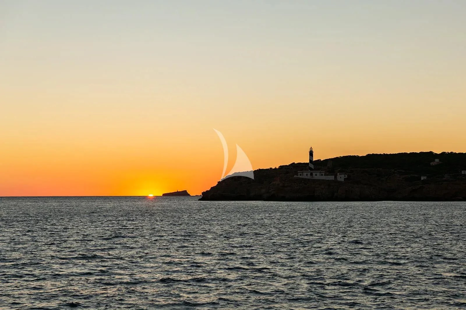 a building on a hill in the water aboard LEMON NOT LIME Yacht for Sale