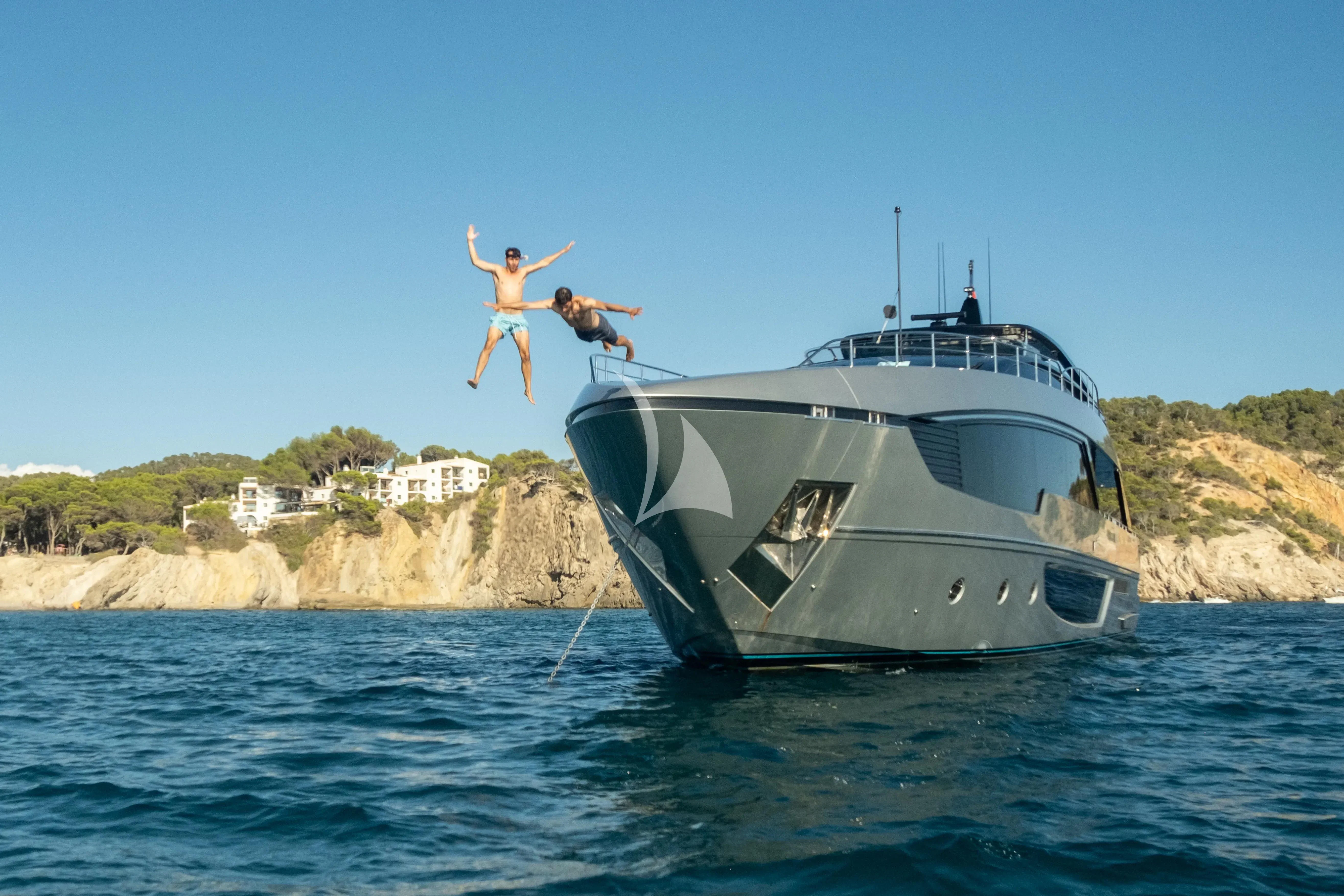 a person jumping off a boat aboard LEMON NOT LIME Yacht for Sale