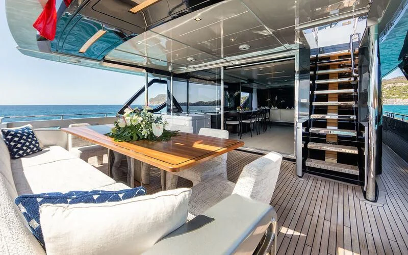 a room with a table and chairs aboard LEMON NOT LIME Yacht for Sale