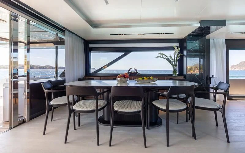 a large kitchen with a table and chairs aboard LEMON NOT LIME Yacht for Sale