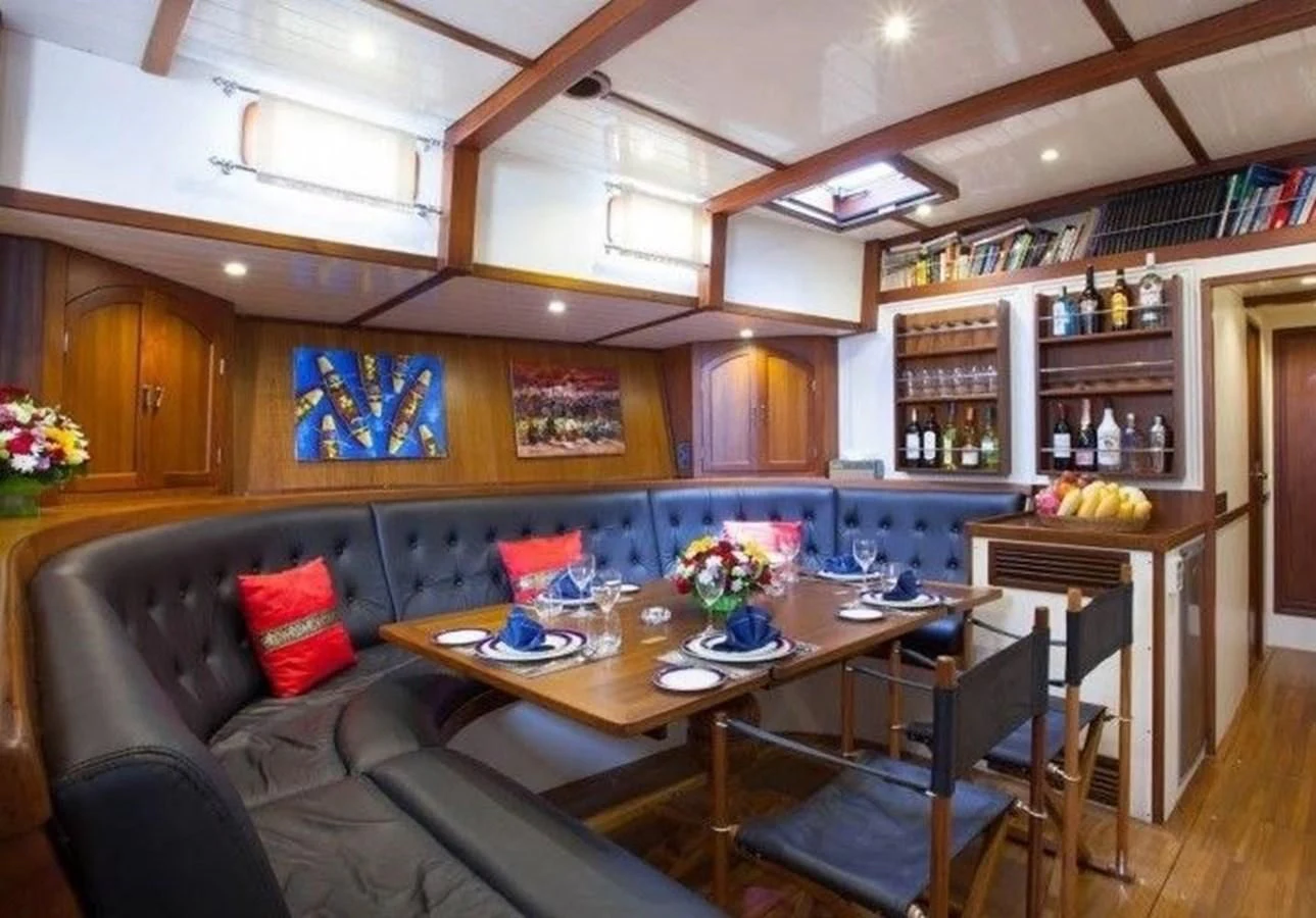 a living room with a leather couch aboard DALLINGHOO Yacht for Sale