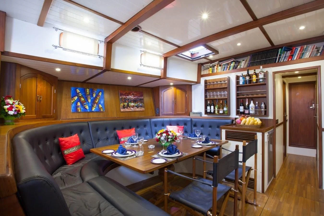 a living room with a couch and a table aboard DALLINGHOO Yacht for Sale