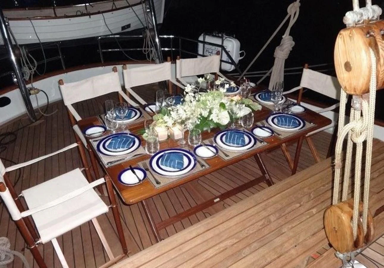 a table with plates and vases aboard DALLINGHOO Yacht for Sale