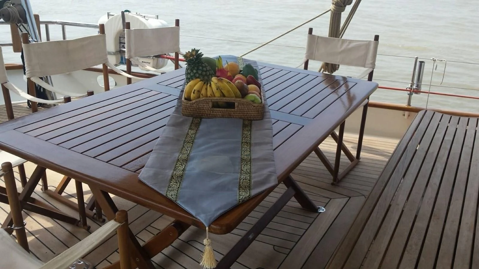 a basket of fruits on a table aboard DALLINGHOO Yacht for Sale
