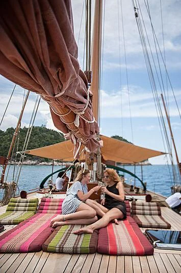 a group of women sitting on a boat aboard DALLINGHOO Yacht for Sale