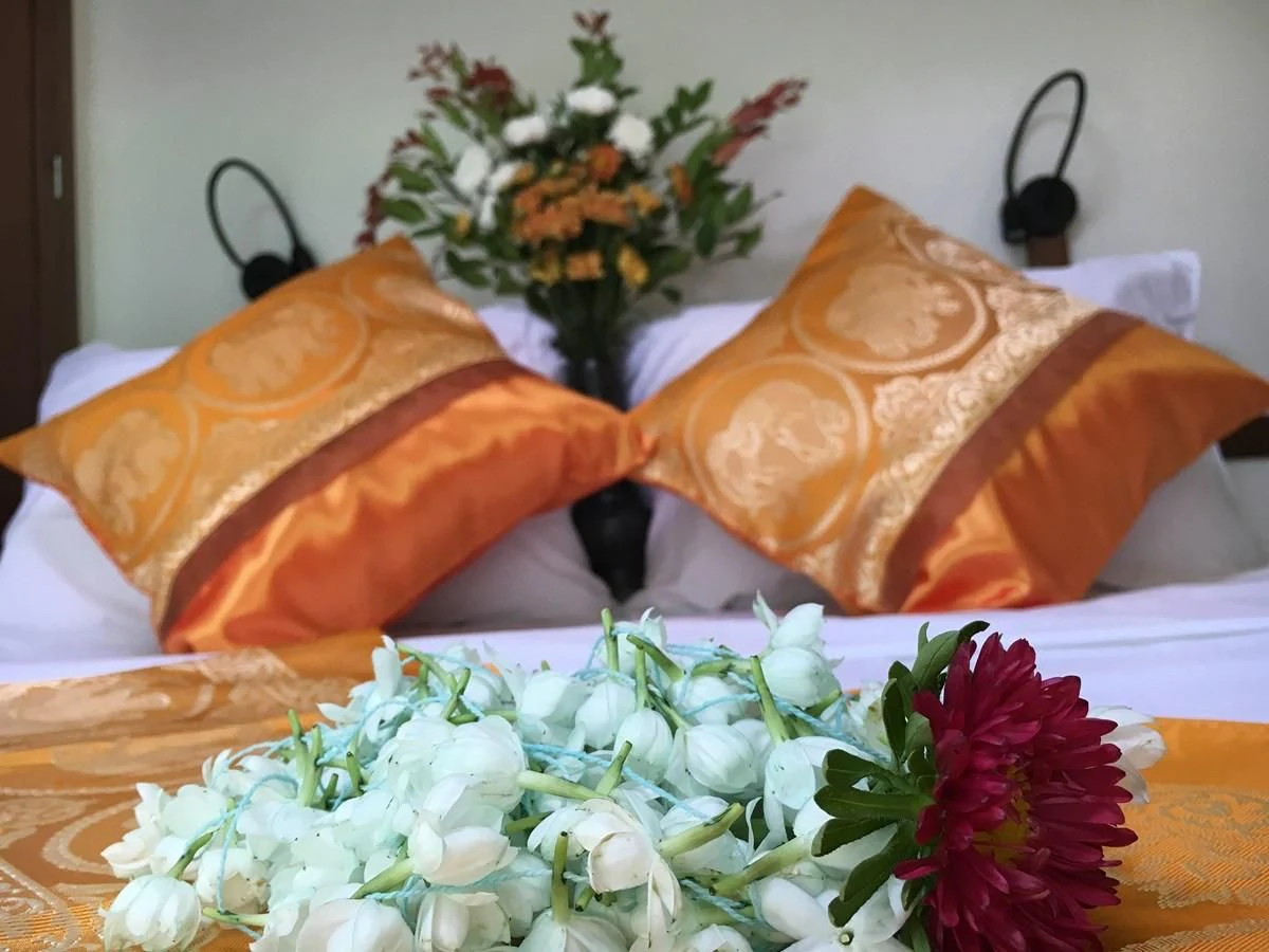 a table with a flower and pillows aboard DALLINGHOO Yacht for Sale