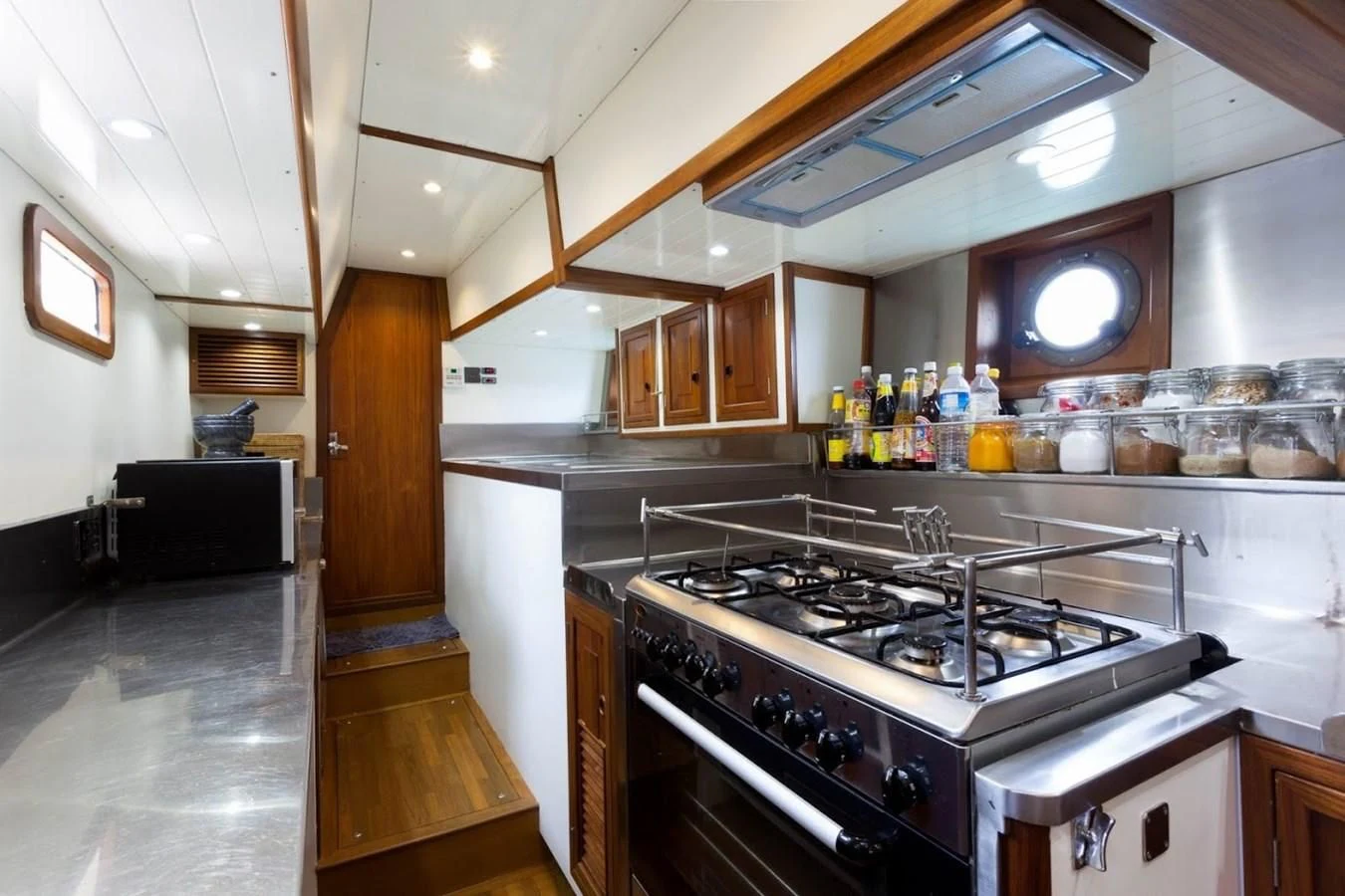 a kitchen with a stove and oven aboard DALLINGHOO Yacht for Sale