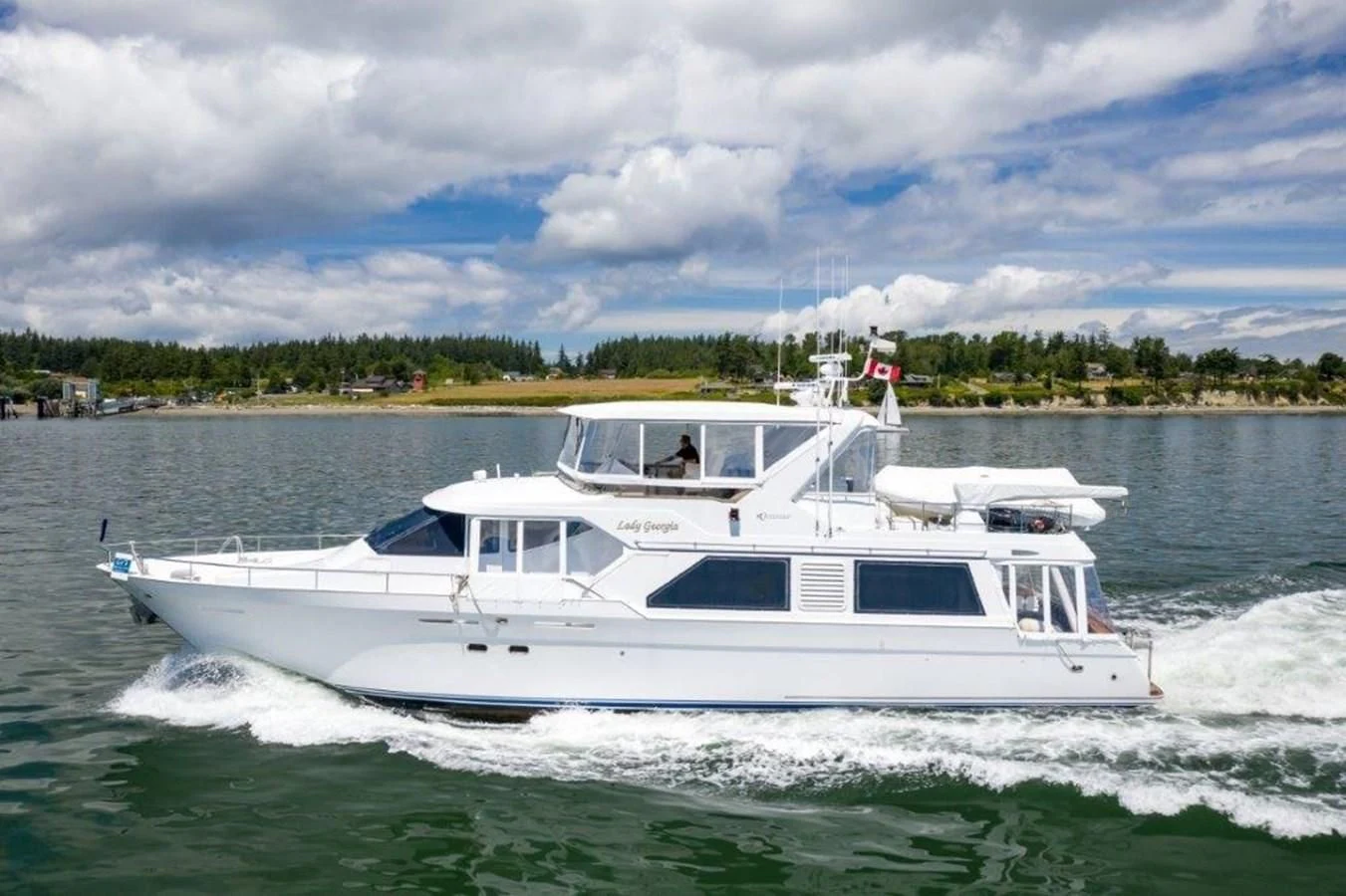 a white boat on water aboard LADY GEORGIA Yacht for Sale