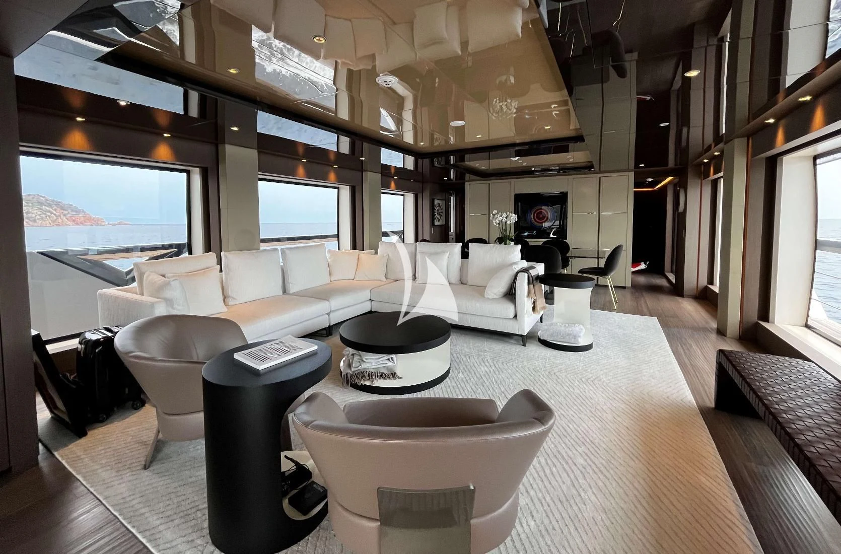 a room with a table chairs and a large window aboard ALVIUM Yacht for Sale