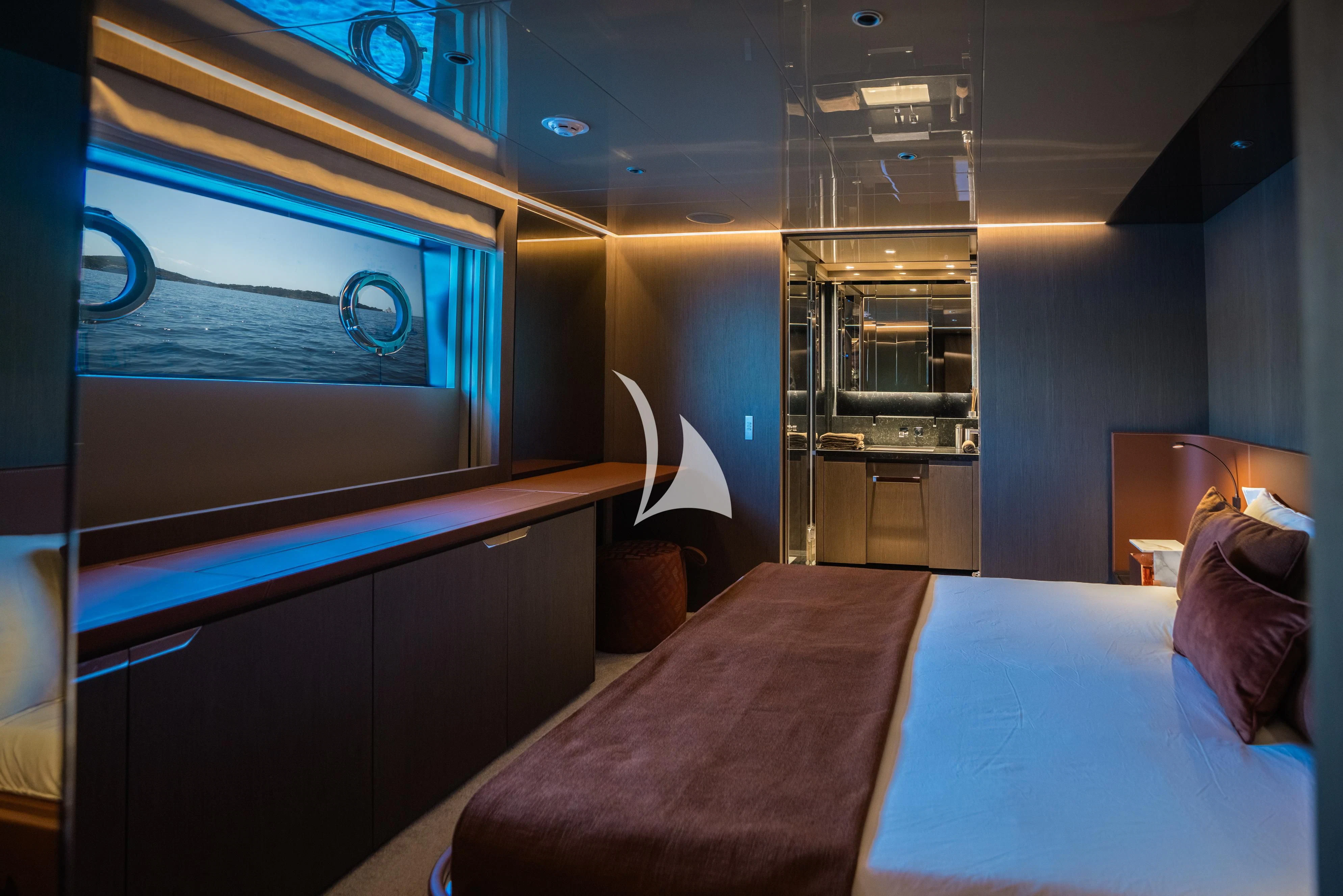 a room with a bed and a couch aboard ALVIUM Yacht for Sale