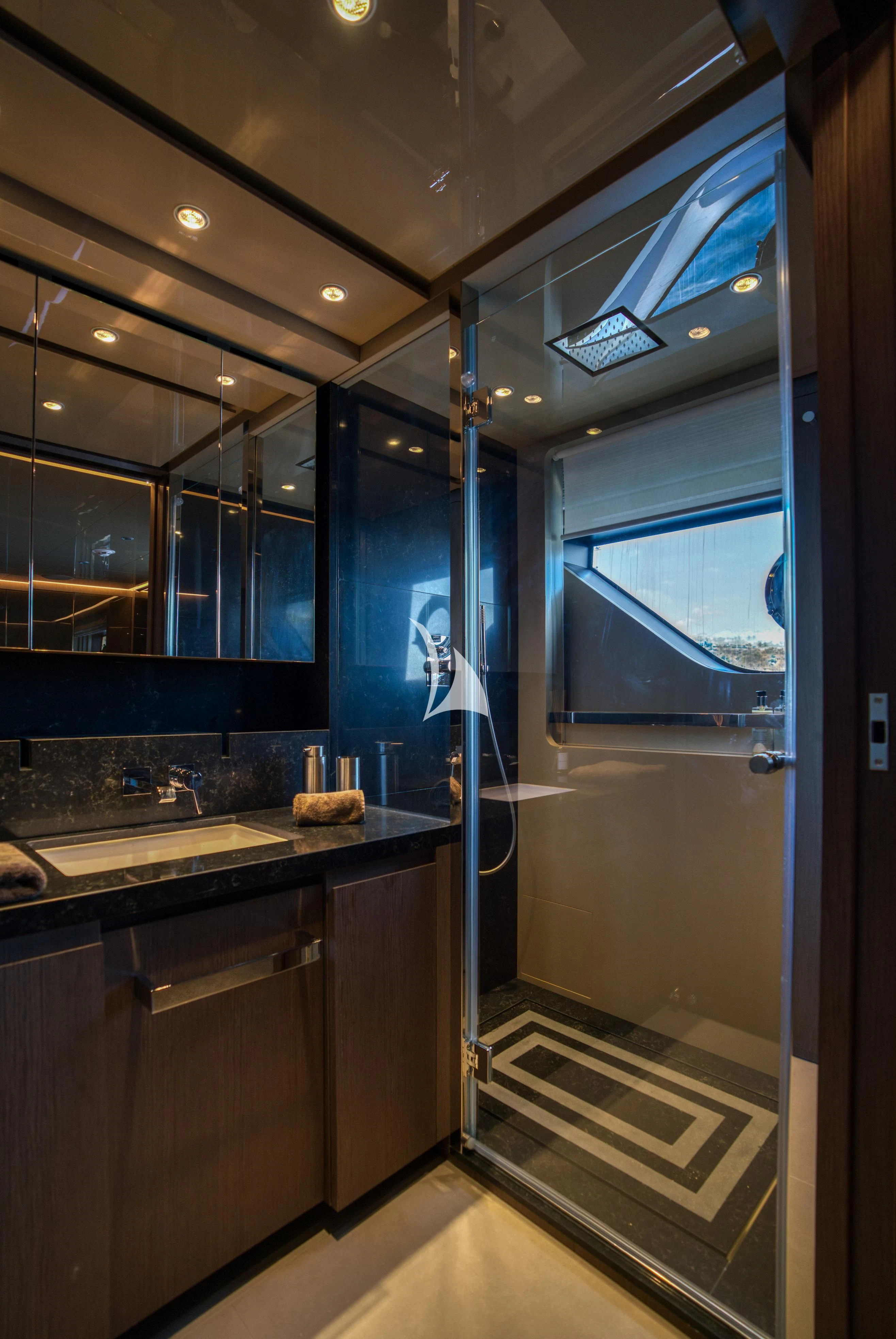 a bathroom with a glass shower door aboard ALVIUM Yacht for Sale