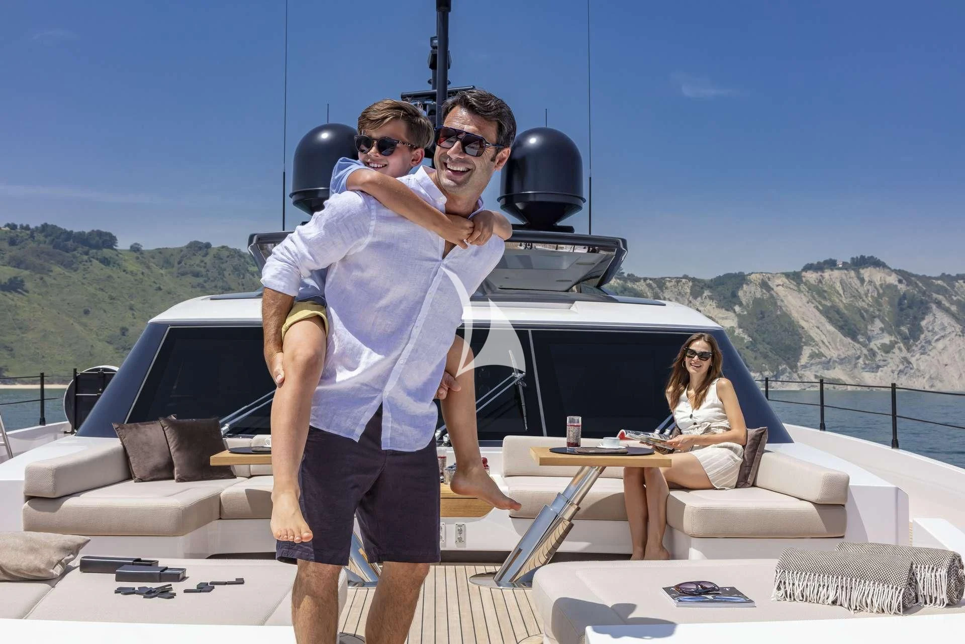 a man holding a woman on a boat aboard ALVIUM Yacht for Sale
